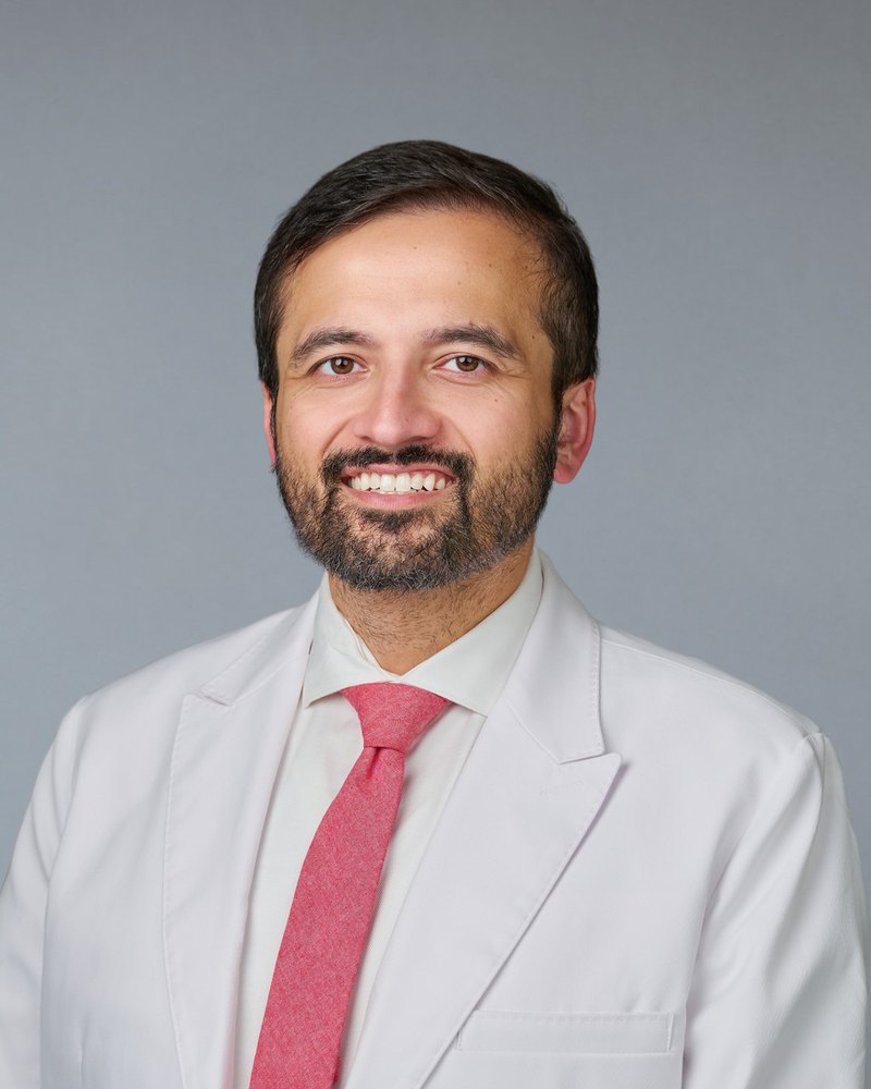 Dr. Farhan Abdullah, DO, Medical Director of Magnolia Primary Care, in a white coat