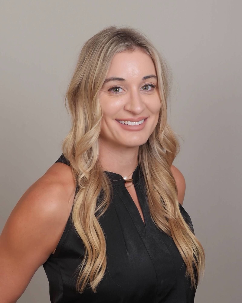 Rachael Bowen, NP, smiling in a black sleeveless top
